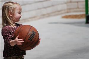 Toddler Girl And Her Basketball