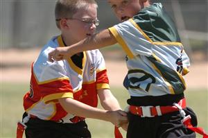 Two flag football players running